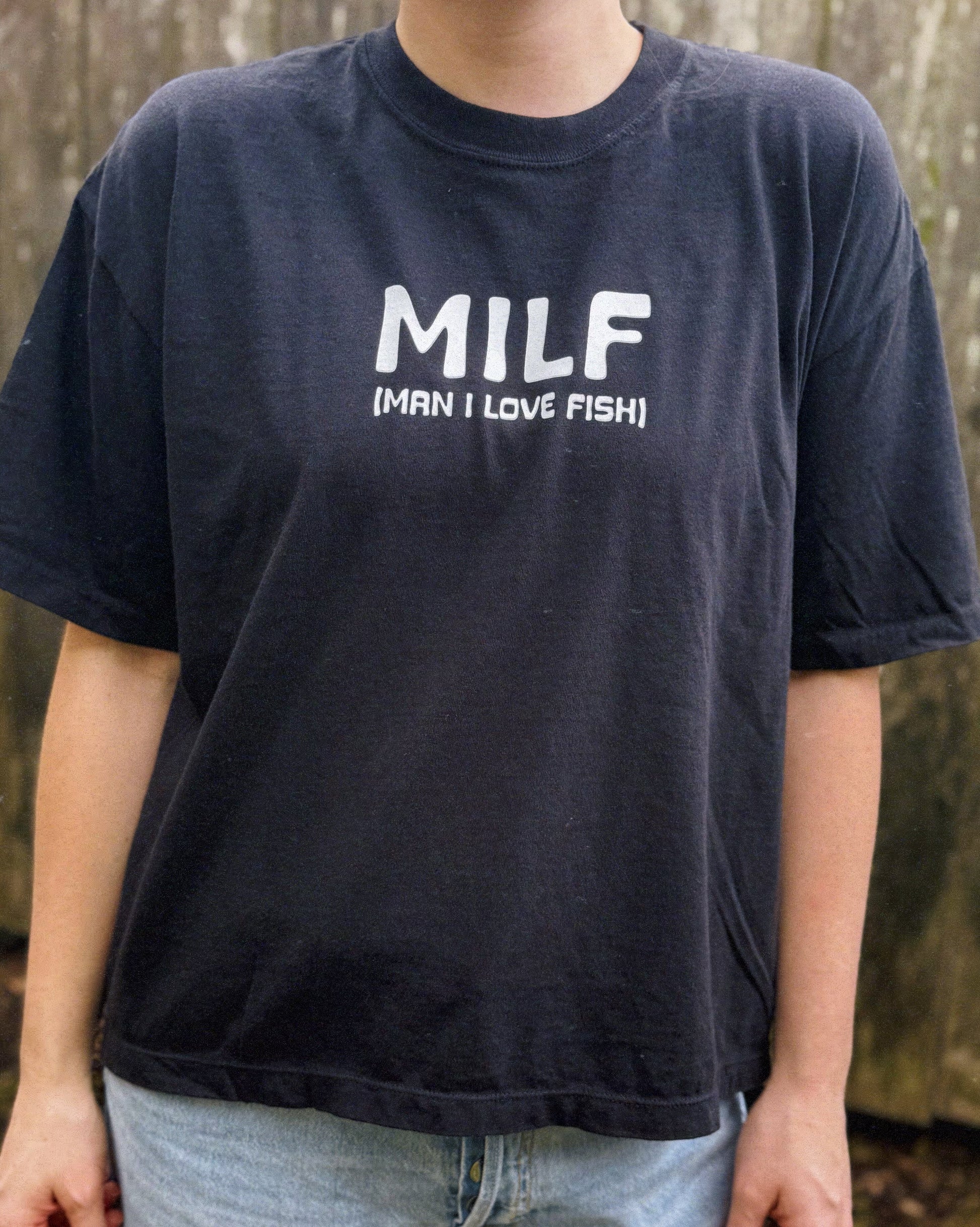 Person wearing a black t-shirt with 'MILF (Man I Love Fish)' text.